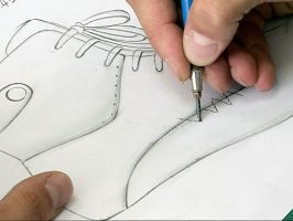 Shoe designer drawing the custom shoe design