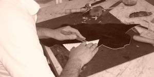 Artisan hand cutting leather